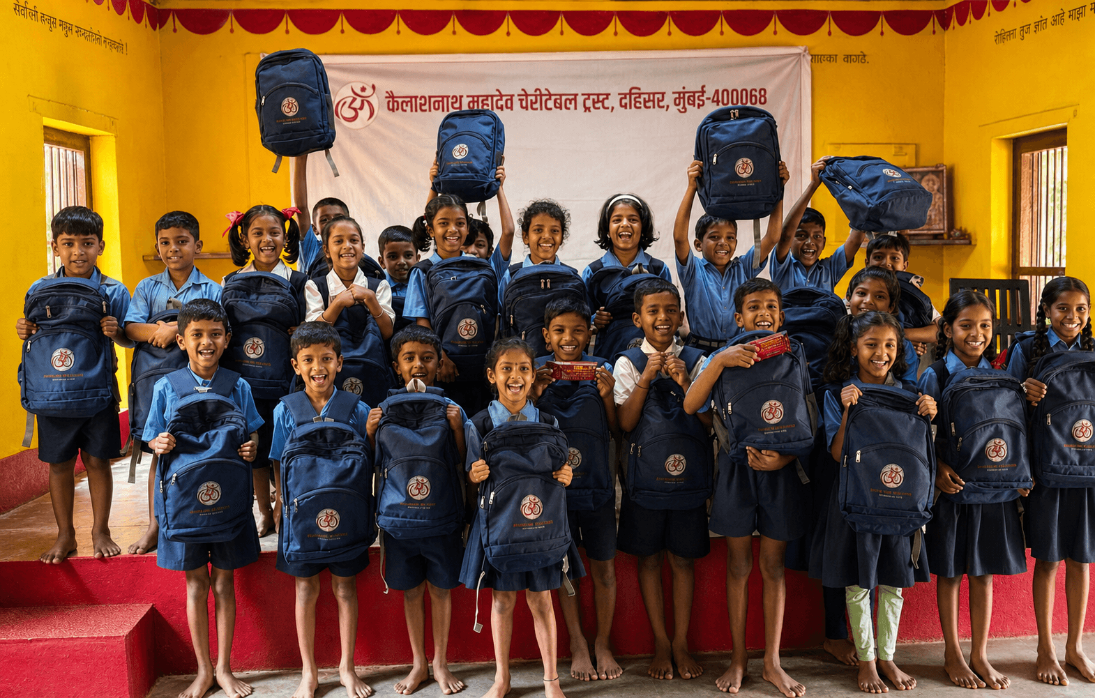 Children with school kits at a Trust community visit